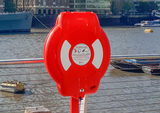 Guardian™ Lifebuoy Housing in red with white graphics and panelling, post-mounted by marina